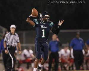 Quarterback Malcolm Hitchcock throws the football against the Sanderson Spartans. In his first three starts at quarterback, he has led the team to an undefeated record. 