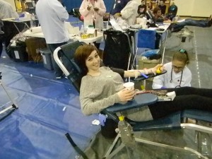 Christie Comer, senior and first-time donor, is excited and anxious about giving blood. Comer says it awesome how you can save lives right at school.