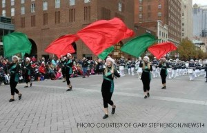 Morgan Barnes, Lauren Elderkin and several other members of the color guard lead the Leesville Marching band down Fayetteville Street among thousands of entertained spectators. The Raleigh Christmas parade prides itself for being the largest of its kind between Washington D.C. and Atlanta, GA.