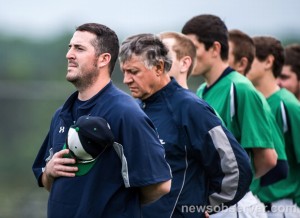 Coach Civitello, assistant coaches, and players remove their caps for the National Anthem.The team had a winning season and top three CAP-8 finish in 2013.