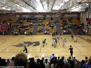 Leesville (blue) and Wakefield (white) players scramble for position during the fourth quarter of Friday's game at Wakefield. The Pride rode a big lead to a 69-48 win.