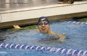 Sean Yeh cheers after his first place finish  in the 100-yard breaststroke during the NCHSAA 4-A State Championships at the Cary Aquatic Center on Feb 7, 2014. Yeh broke a state record after finishing at 55.06. 