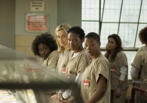 The recurring cast members of Netflix’s breakout comedy-drama, Orange Is the New Black, with main character Piper Chapman (center). The show returns for its second season June 6, 2014.