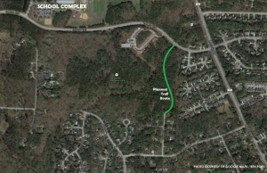 The current satellite of the Leesville Park and the surrounding roads, with the trail path outlined in dashed red. More trails are planned for the years ahead to circle through the currently undeveloped green space.