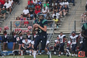 Clay Vick, junior quarterback, drops back to pass and looks for a target. Vick completed over 80% of his attempts for three touchdowns. 