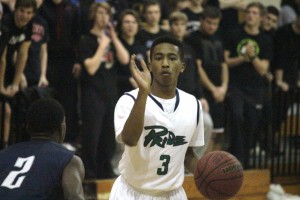 Alex Hunter (#3) calls a play for Leesville in front of the blackout Loonies student section.