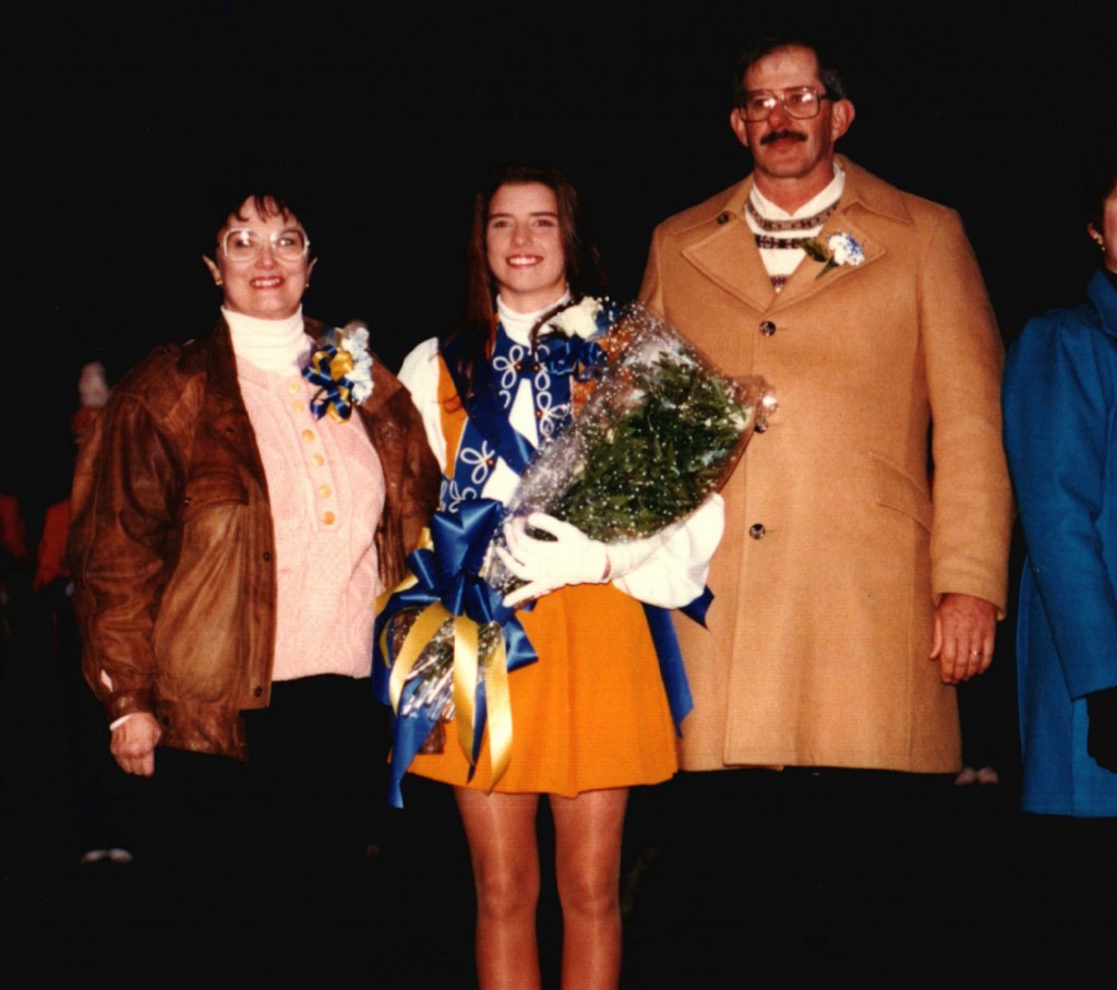 Ms. Engdahl stands with her parents during senior night. She also has a younger brother, who is not pictured. (Photo courtesy of Michelle Engdahl.)