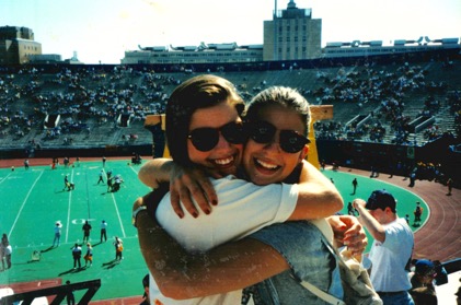  Photographed during her sophomore year of college, Ms. Engdahl hugs one of her friends at Pitt Stadium. She attended the University of Pittsburgh from 1994 to 1998. (Photo courtesy of Michelle Engdahl.)