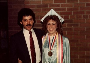 Ms. Wedge on her high school graduation day in 1984. Pictured on her left is her track coach, Mr. Schomorrow.(Used by permission of Amy Wedge)