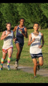 Carson Ellerby (center) races in a cross country meet as a member of the Leesville cross country team. Ellerby first started running in sixth grade when he participated in the Raleigh RunDown Downhill Mile. (Photo used by permission of Carson Ellerby)