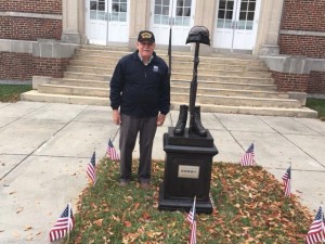 Hoffman stands beside the Vietnam War memorial, located outside the Clayton town center. (Photo courtesy of Matt Wiener).