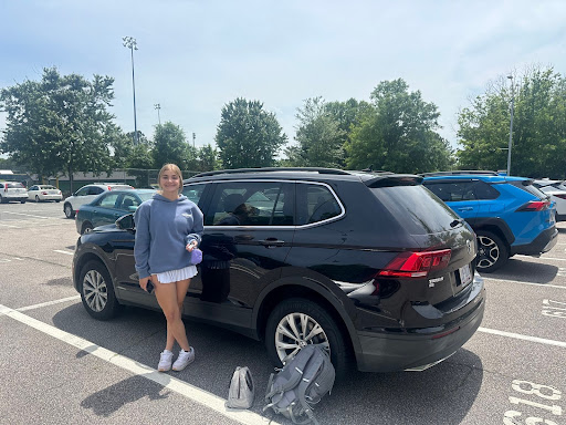 Pictured, Avery Goodwin who is a licensed sophomore, in the Leesville parking lot. Although she can drive to school, she is not allowed to access her car during lunch. (Photo credits Kaylee O’Brien)